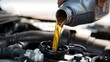 © SY_designHouse - Pouring new motor oil into a car engine during maintenance