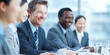 © Thunyakan - professionals discuss a group of technology company meeting planning, diversity, paperwork, report