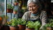 © Kantapong - Elderly woman tending to her potted plants indoors.