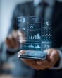 © Warakorn - smart tax planning app interface projected in front of business user