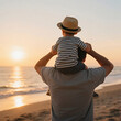 © Macholicious - Father Carrying Child on Shoulders at Beach During Sunset