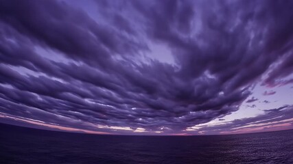Wall Mural - breathtaking 4k timelapse of dramatic sunset sky over the sea clouds glowing shades of purple red gold transitioning from day to night capturing the beauty of nature’s sky painting cinematic