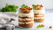 © Sri - Layered Dessert In Glass Jars With Crumble Topping