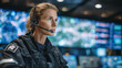 © Maksym - Side profile of a focused woman in emergency services uniform, headset microphone close to lips, as she inputs critical data on illuminated touchscreens displaying maps, vehicle lo