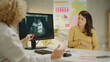 © Videophilia - Gynecologist showing ultrasound scan to pregnant woman in clinic