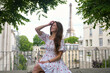 © Moiseii Production - Woman in summer dress near Eiffel Tower