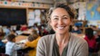 © Johannes - teacher smiling at camera in classroom at the elementary school no logos no brands ar 169