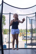 © Marina Chernivetskay - Girl Jumping on a Trampoline in Summer