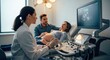 © irawan710 - Pregnant woman undergoing ultrasound with doctor and partner