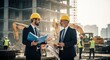 © irawan710 - Two construction site managers discuss blueprints.  Construction workers are visible in background.  Sunny day.  Large building under construction.  Men in suits and hard hats
