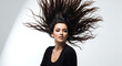 © Taha - Brunette woman with long dark hair dramatically tossed against a white backdrop in a studio setting ai generated
