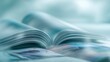 © Yudhi - Open magazine with glossy pages displaying colorful pictures; blurry background, cool cyan tone