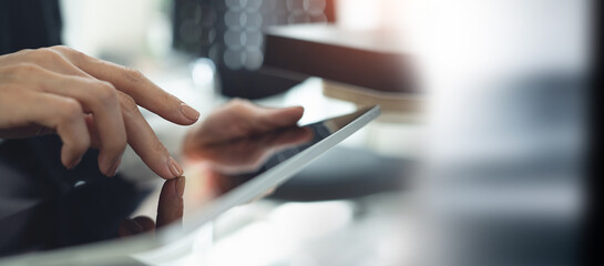 Wall Mural - close up. woman using digital tablet for internet networking at office. business finance and technol