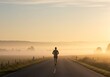 © Edi - Lone Runner on Rural Road at Sunrise