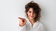 © e_zeynall1 - A captivating portrait of a woman with curly hair, making a direct and engaging gesture of pointing, framed by a simple backdrop. Emphasizing connection and direction.