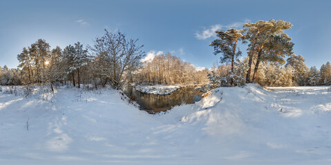 Wall Mural - 360 hdri panorama near narrow fast river in a winter sunny forest. 360 panorama in full seamless spherical equirectangular projection. VR AR virtual reality content