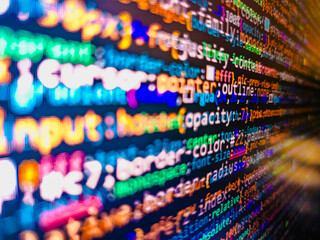Minificated web development javascript code close up in sunset rays. Information technology website coding standards for web design Big data database app. Abstract computer script source code