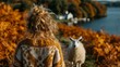 © the mengs - Woman in a knitted sweater facing away from the camera, standing in a field of autumn ferns with a sheep nearby and a lake in the background