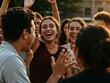 © Sergey - A joyful group of young adults, bathed in golden hour light, laughing heartily outdoors, expressing genuine happiness and camaraderie.
