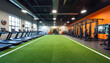 © miss irine - Spacious modern gym interior features green turf, treadmills, weight machines, high ceilings with bright lighting. Open training area promotes fitness activities, strength training, cardio, agility,