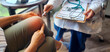 © Khunatorn - Patient showing knee pain to a doctor holding a clipboard and stethoscope, during a medical consultation for joint injury or arthritis treatment in a bright clinic setting