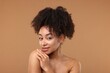© New Africa - Portrait of beautiful Brazilian woman after spa treatment on light brown background