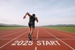 © The Little Hut - Athlete Sprinting on Track Marked with 2025 Start Line, Symbolizing New Year Goals and Aspirations