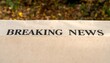 © PANGERAN - Breaking News headline printed on a vintage newspaper outdoors. Concept of media, urgent information, and important announcements.