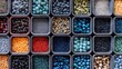 © Qwini - Small square containers filled with various colorful beads