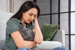 © Pixel-Shot - Depressed young woman with pillow at home