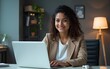 © ning - Smiling young latina hispanic business woman working on laptop computer in office. Focused Indian businesswoman professional manager IT specialist using AI pc app, thinking, make analysing. Copy space