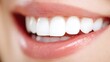 © Nan - Close-up of a natural smile with perfect white teeth, highlighting dental health and confidence.