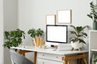 © Pixel-Shot - Interior of stylish home office with comfortable workspace, modern computer and houseplants