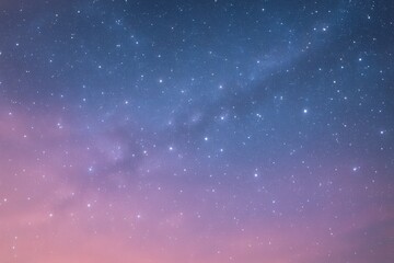 Wall Mural - A serene night sky, dotted with countless stars, transitions from a deep blue at the top to a soft pink hue near the horizon