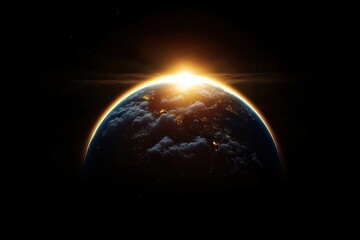 sunrise over the earth from space showing illuminated continents with clouds and dark outer space ba