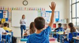 A young boy raises his hand to answer a question in a lively classroom environment.