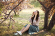 © Buyanskyy Production - Happy Woman Enjoying Sunshine Under Blossoming Tree in Spring Garden