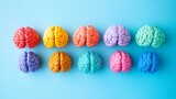 40.Artistic plasticine brain model, segmented into different colors with small metallic details, conceptual visual of amnesia and mental function, arranged on a light blue background