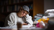 © SolaruS - A young adult studies late, using a phone amidst a pile of books. Concept of education, procrastination, technology distraction. Suitable for articles, blogs.