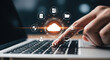 © Chanthakan - Cloud computing, data storage, digital network, and online technology concept with person using laptop, finger touching virtual cloud icon, futuristic interface, and glowing connection symbols