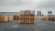 © adaptable_ Lark98A1 - Pallets stacked in an outdoor storage area, surrounded by industrial buildings under a cloudy sky.