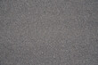 © Sergey - Seamless uniform dark gray stone granules texture, gravel aggregate surface background