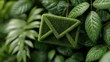 © Rashid - Green grass envelope symbol resting among lush vibrant green leaves Nature