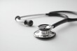 © fotodrobik - A stethoscope on a white background symbolizes healthcare, ready for immediate use