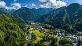 Aerial view of small village nestled in the valley of mountains in Chichibu Tama Kai National Park, Japan during daytime