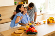 © BGStock72 - Joyful family moment in a bright kitchen preparing healthy breakfast together