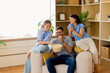 © BGStock72 - Family bonding moments during movie night with laughter and popcorn enjoyment