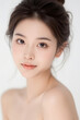 © Eggy - Female Asian Model with Short Hair - Young Beautiful Woman with Hair Bun - Studio Portrait of Asian Beauty for Fashion, Cosmetic, Skincare - Posing on White Background - Smooth Tied Hair