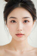 © Eggy - Female Asian Model with Short Hair - Young Beautiful Woman with Hair Bun - Studio Portrait of Asian Beauty for Fashion, Cosmetic, Skincare - Posing on White Background - Smooth Tied Hair