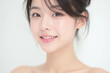 © Eggy - Female Asian Model with Short Hair - Young Beautiful Woman with Hair Bun - Studio Portrait of Asian Beauty for Fashion, Cosmetic, Skincare - Posing on White Background - Smooth Tied Hair